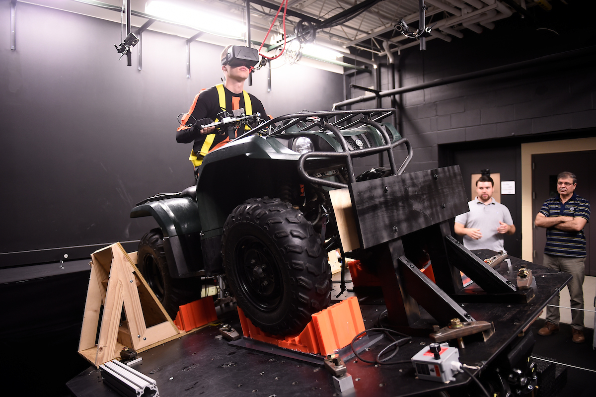 Researchers operating an ATV simulator