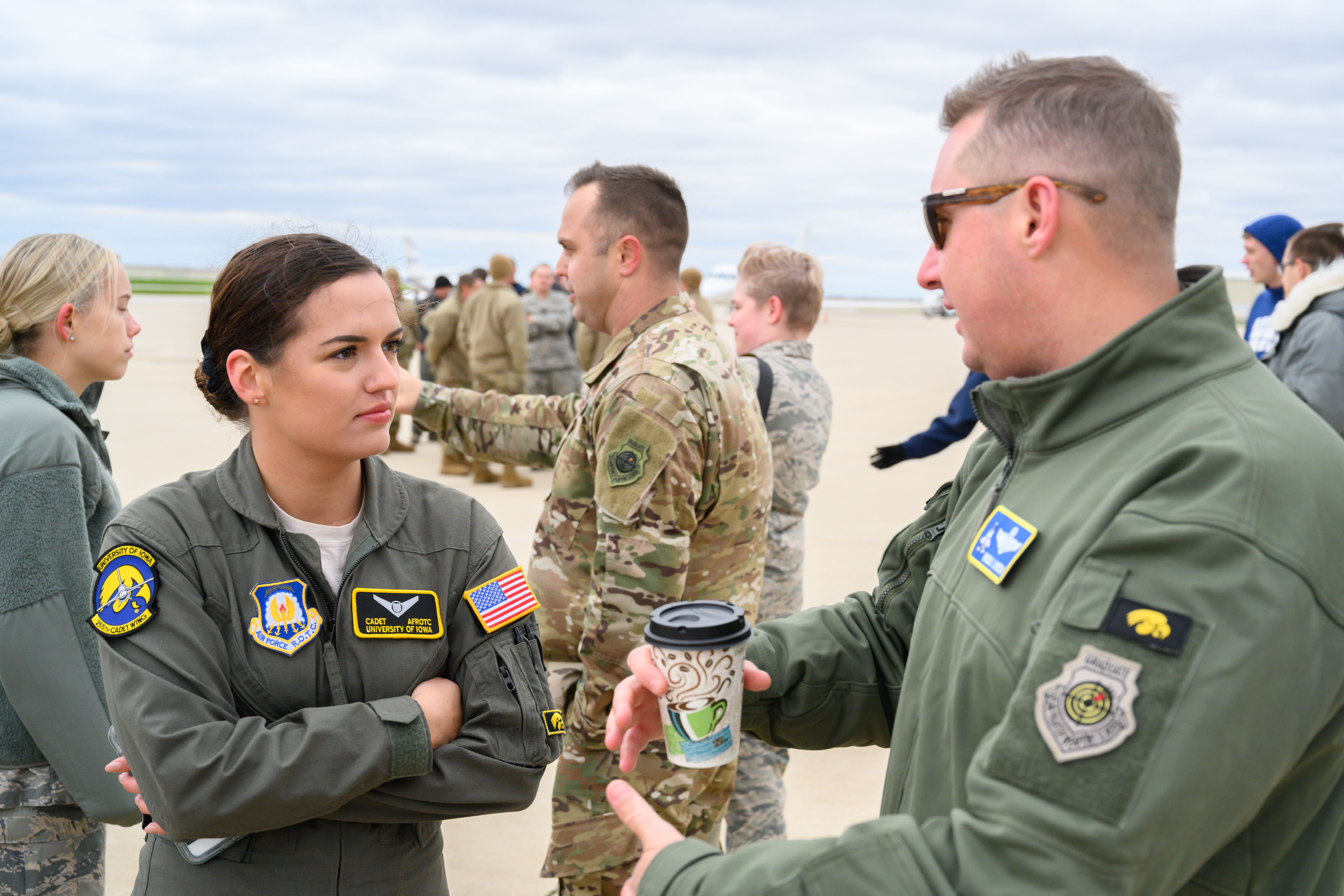 Photo of Abbie Moore talking with pilots