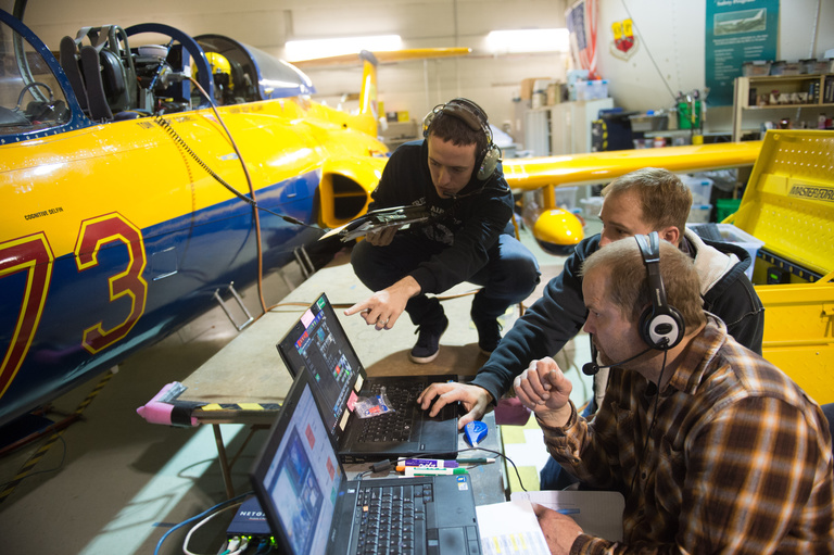 Researchers in Hangar with L29