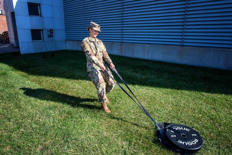 ROTC cadet dragging a weight