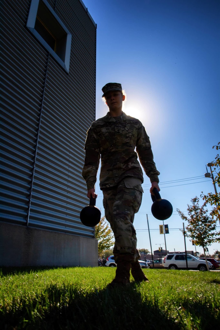 ROTC cadet carrying kettlebells
