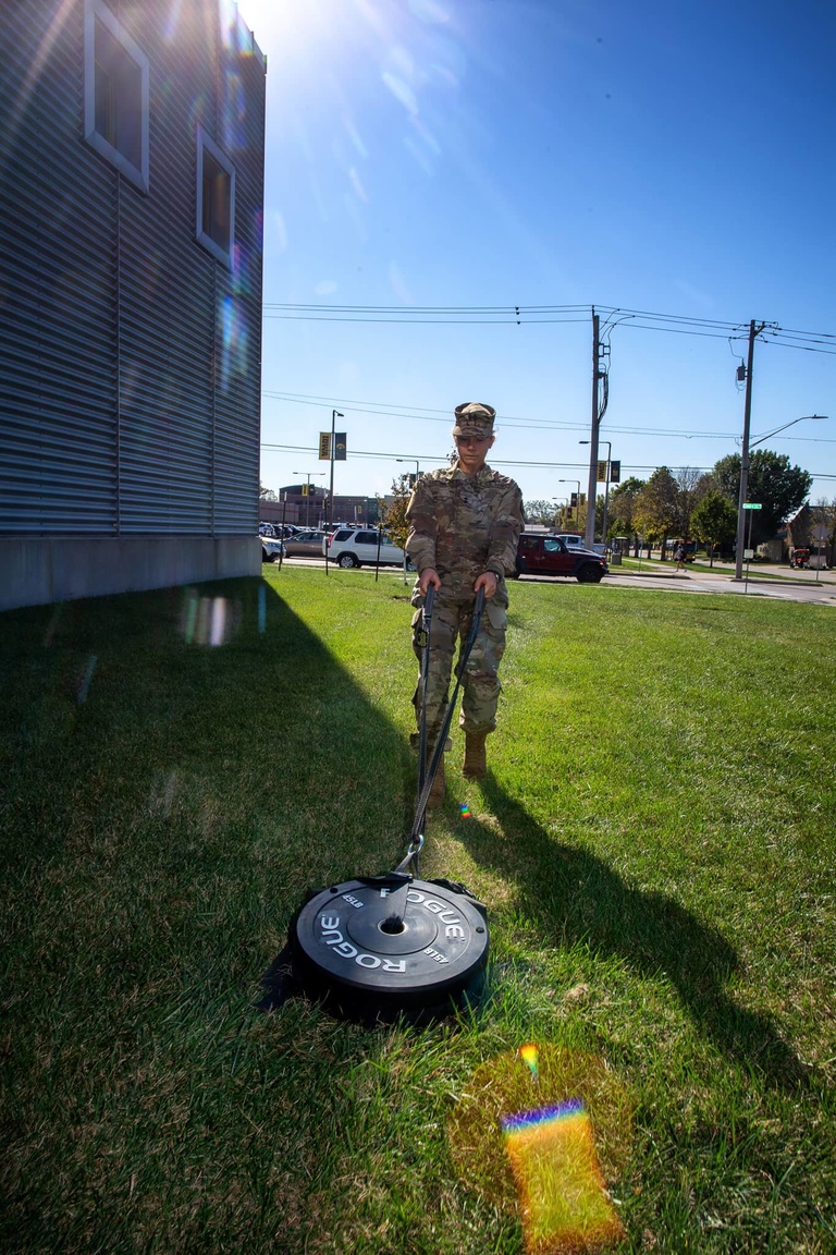 ROTC cadet dragging a weight