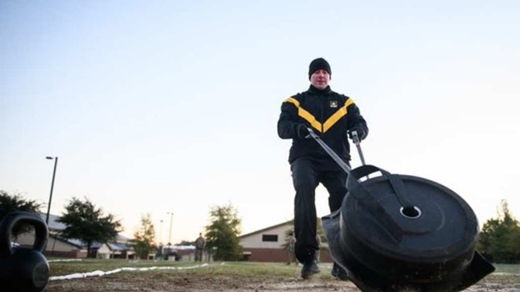 A soldier does the sprint-drag-carry portion of the Army Combat Fitness Test